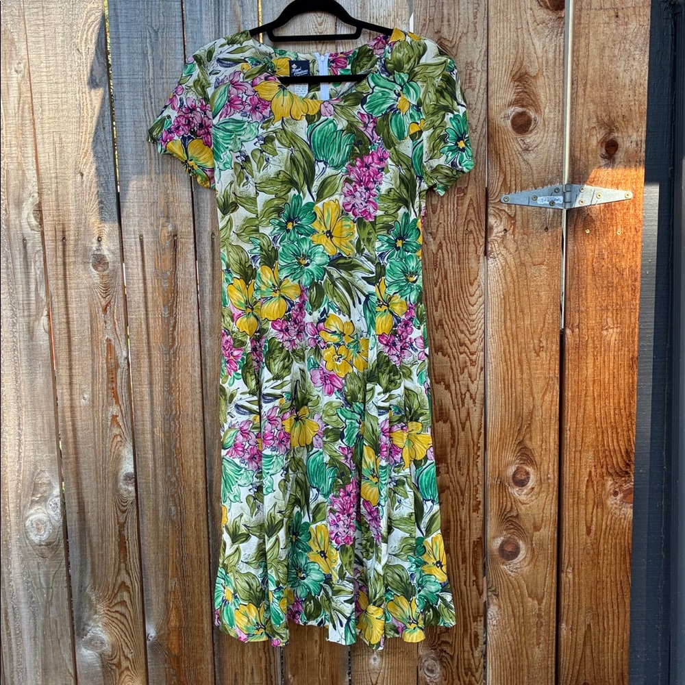 This is a floral dress by the brand Royal Creations, made in Hawaii